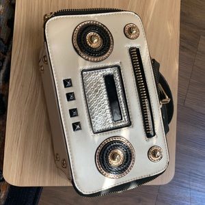 Gold and black Boombox shoulder purse.
